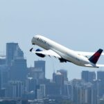 Delta profits beat expectations but company warns of slowing growth, scales back expansion plans for second half