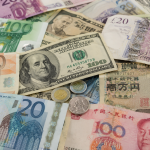 Global currencies trade in narrow ranges as markets focus on inflation and oil